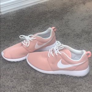 Peach Nike sneakers
